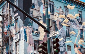 Um mural de rua mostra a foto de músicos e outras pessoas