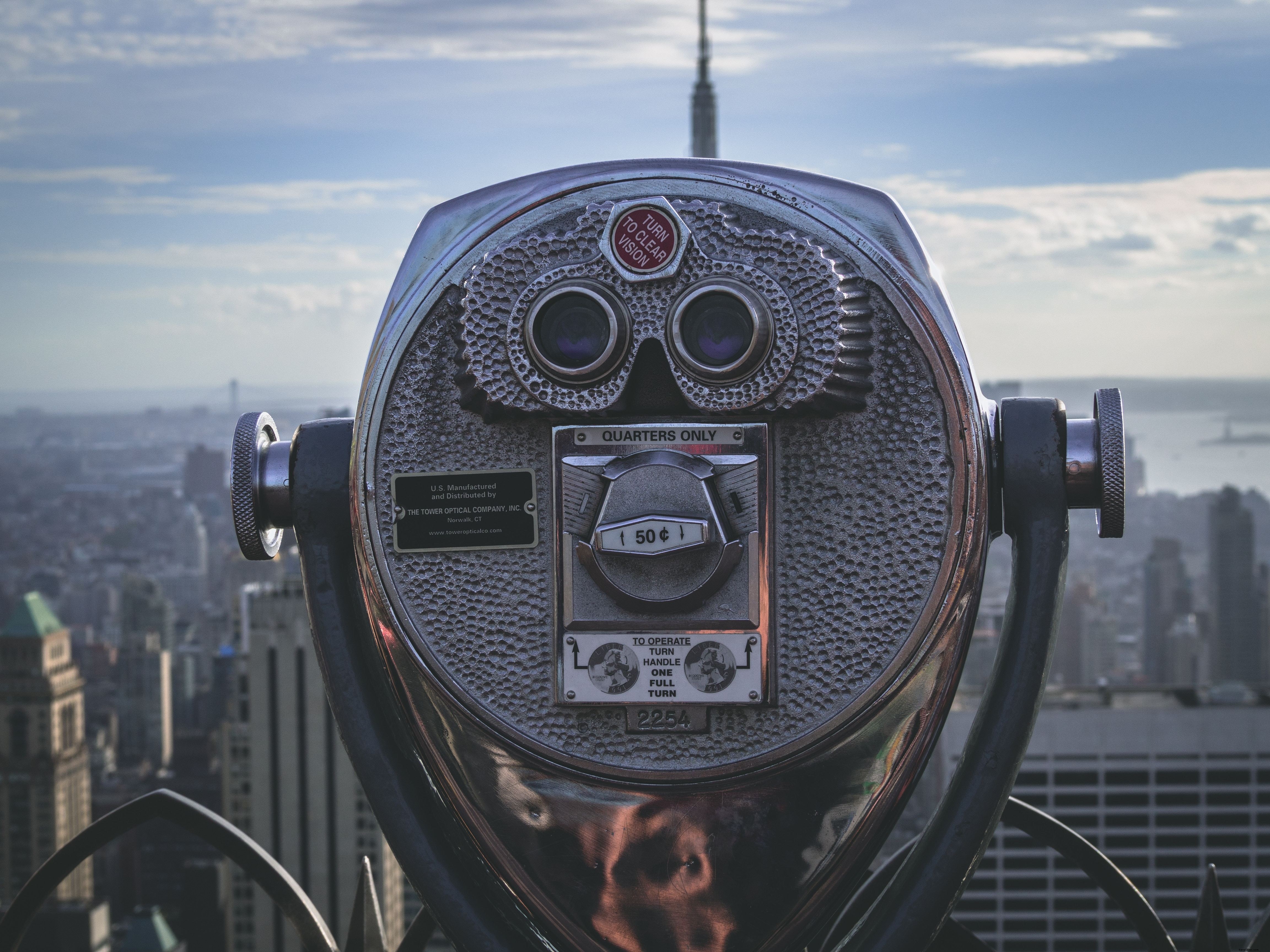 Telescopio de vista turística en la ciudad de fotos