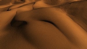 Foto de montanhas de areia laranja vibrante e textura ondulada 